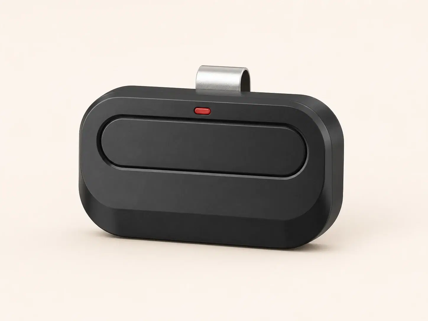 Illustrative rendering of a wide black visor remote with one pill-shaped button