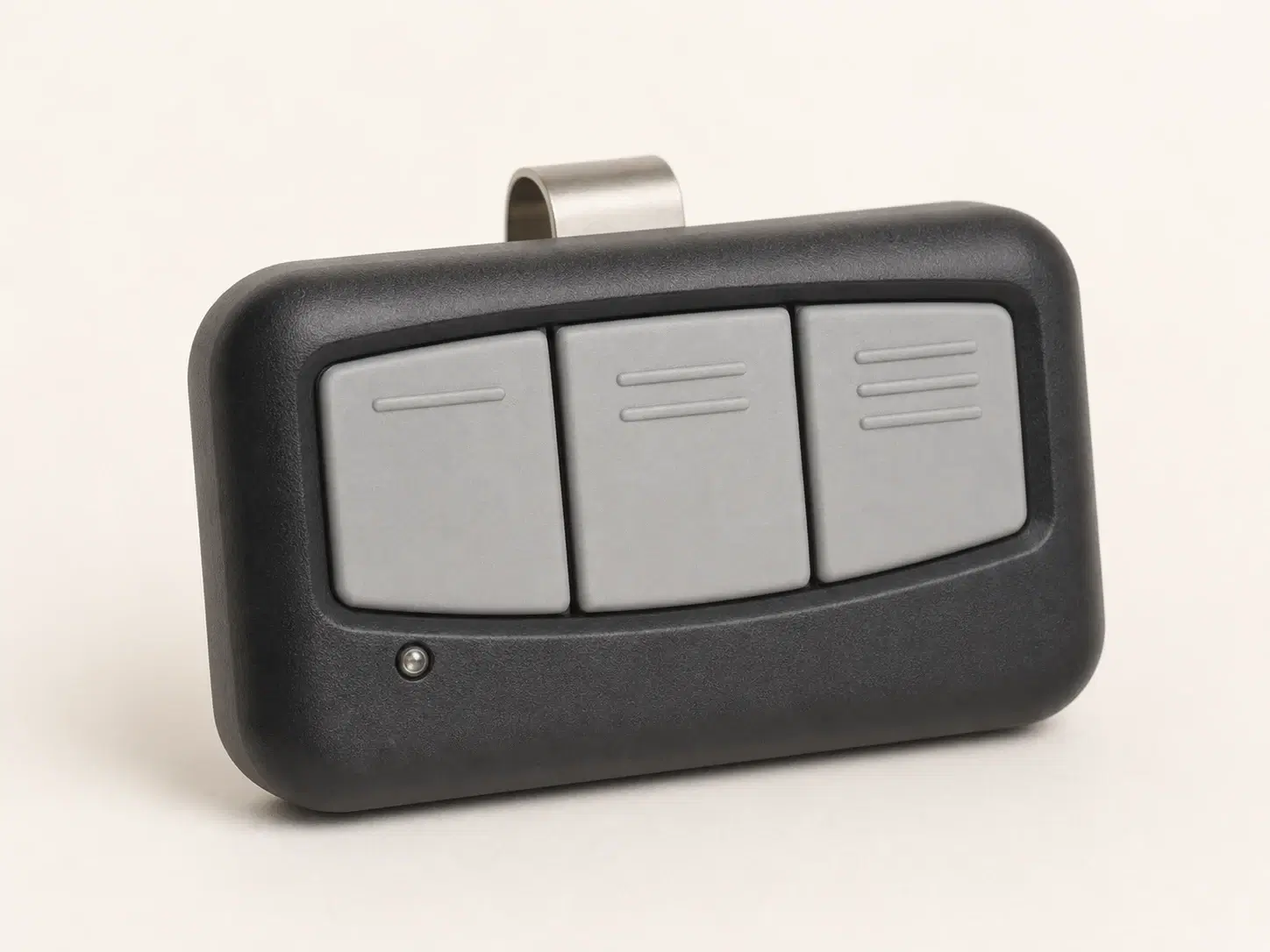 Illustrative rendering of a wide black visor remote with three light gray buttons