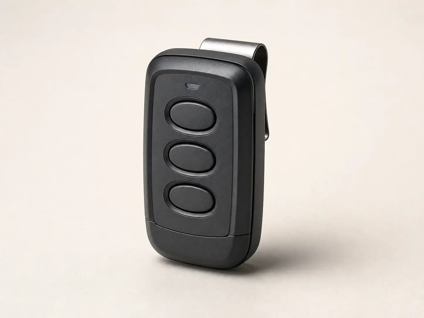 Illustrative rendering of a dark three-button Guardian-compatible visor remote