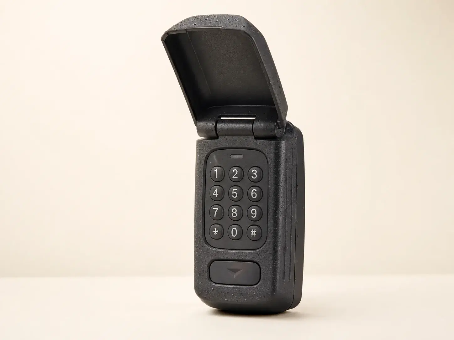 Illustrative rendering of a dark weatherproof Guardian-compatible wireless keypad